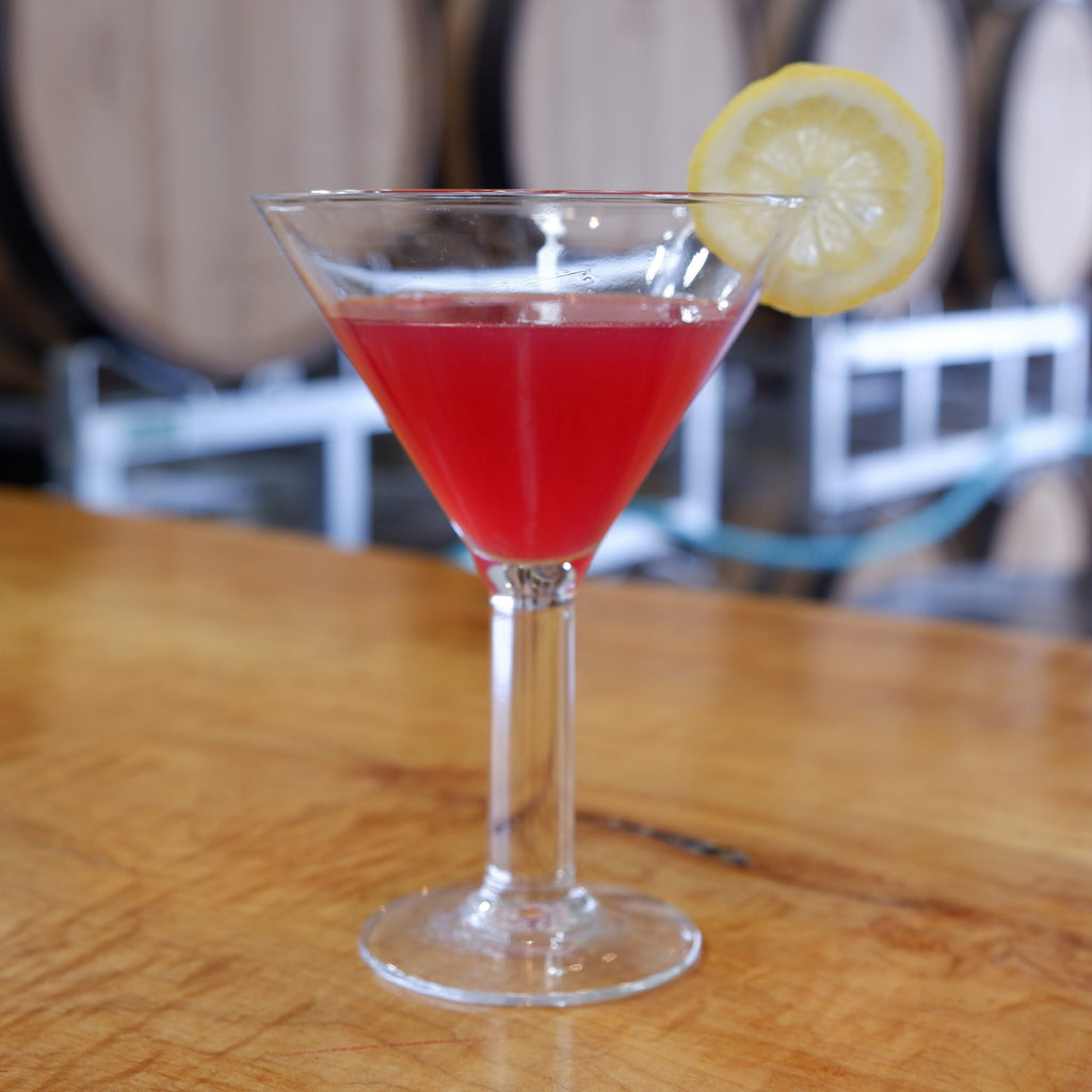 Limoncello cocktail, made with cranberry juice in martini glass garnished with lemon wheel
