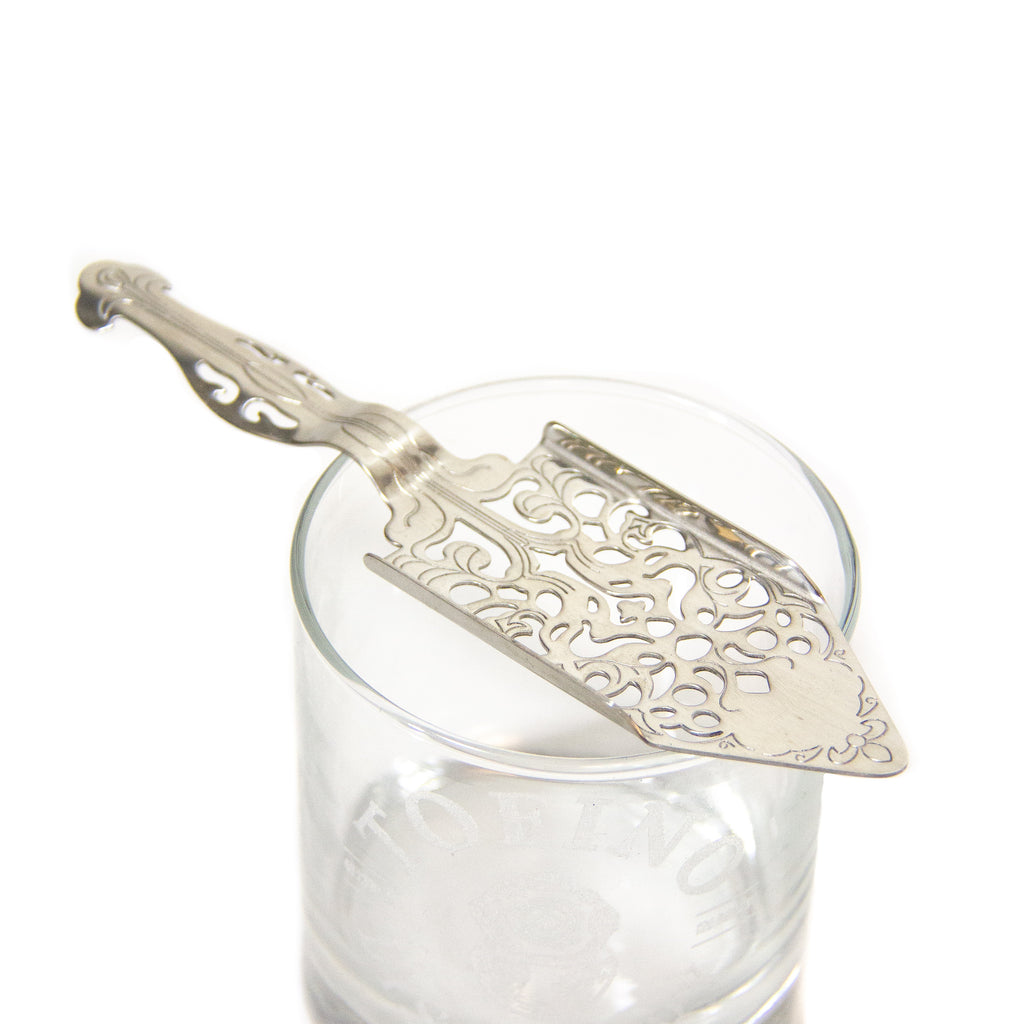 Absinthe spoon perched on top of Tofino Distillery rocks glass
